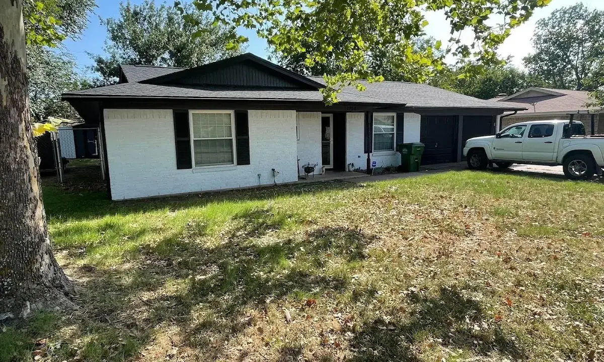 Professional roofing crew working on a residential roof in Montrose-Ghent